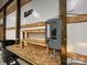 Workshop workbench with exposed electrical panel and outlets at 50 Berea Church Quincy Rd, Hiddenite, NC 28636