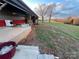 View of the workshop's exterior and expansive green field at 50 Berea Church Quincy Rd, Hiddenite, NC 28636