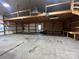 Spacious workshop featuring a loft, ample shelving, and a large overhead door at 50 Berea Church Quincy Rd, Hiddenite, NC 28636