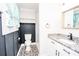 Bathroom vanity with granite countertop and stylish patterned tile floors at 5020 Foster Rd, Cleveland, NC 27013