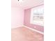 Bright bedroom featuring carpet flooring, neutral paint, and a window at 5020 Foster Rd, Cleveland, NC 27013
