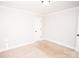 This is a bedroom with neutral walls and a light carpet with black door hardware at 5020 Foster Rd, Cleveland, NC 27013