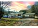Charming single-story home featuring a covered front porch and convenient carport at 5020 Foster Rd, Cleveland, NC 27013