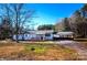 Charming single-story home featuring a covered front porch and convenient carport at 5020 Foster Rd, Cleveland, NC 27013