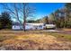 Charming single-story home featuring a covered front porch and convenient carport at 5020 Foster Rd, Cleveland, NC 27013