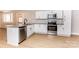 Updated kitchen boasts granite countertops, stainless steel appliances, and stylish fixtures at 5020 Foster Rd, Cleveland, NC 27013