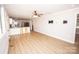 Spacious open-concept living room and kitchen area with hardwood floors at 5020 Foster Rd, Cleveland, NC 27013