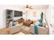Bright, staged living room with hardwood floors, modern furniture, and stylish decor at 5020 Foster Rd, Cleveland, NC 27013