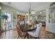 Bright dining room features hardwood floors and view into the kitchen at 55327 Derringer Ave, Fort Mill, SC 29707