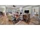 Comfortable living room with hardwood floors and views into other rooms at 55327 Derringer Ave, Fort Mill, SC 29707
