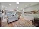 Spacious living room with hardwood floors, fireplace, and ample natural light at 55327 Derringer Ave, Fort Mill, SC 29707