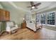 Spacious main bedroom with hardwood floors and a ceiling fan at 55327 Derringer Ave, Fort Mill, SC 29707