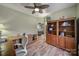 Spacious home office with wood floors, built-in shelving, and access to the living room at 55327 Derringer Ave, Fort Mill, SC 29707