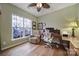 Home office with hardwood floors, large window with stained glass, and comfortable seating at 55327 Derringer Ave, Fort Mill, SC 29707