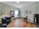 Home office with hardwood floors, comfortable seating and built-in shelves at 55327 Derringer Ave, Fort Mill, SC 29707