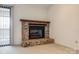 Brick fireplace with wood mantel in living room at 5843 Harris Grove Ln, Charlotte, NC 28212