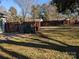 Backyard with fenced area, patio, and grassy lawn at 5938 Trysting Rd, Charlotte, NC 28227