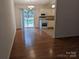 Bright dining area with hardwood floors and sliding glass door leading to backyard at 5938 Trysting Rd, Charlotte, NC 28227