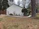 House exterior showcasing a side view, walkway, and landscaping at 5938 Trysting Rd, Charlotte, NC 28227