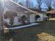 Ranch style home with landscaped yard and walkway at 5938 Trysting Rd, Charlotte, NC 28227