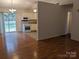 Kitchen with white cabinets and appliances, hardwood floors at 5938 Trysting Rd, Charlotte, NC 28227