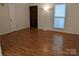 Living room featuring hardwood floors and neutral walls at 5938 Trysting Rd, Charlotte, NC 28227