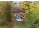 Single-story home and driveway, surrounded by trees at 612 Harry St, China Grove, NC 28023