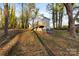 House with deck and storage building in wooded backyard at 612 Harry St, China Grove, NC 28023