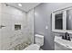 Clean bathroom with white tile shower and stone accents at 612 Harry St, China Grove, NC 28023