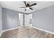 Bright bedroom with wood-look flooring and access to bathroom at 612 Harry St, China Grove, NC 28023