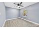 Simple bedroom with grey walls and hardwood floors at 612 Harry St, China Grove, NC 28023