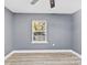 Simple bedroom with wood-look flooring and a window at 612 Harry St, China Grove, NC 28023
