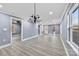 Bright dining room with hardwood floors and chandelier at 612 Harry St, China Grove, NC 28023