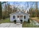 Gray house with white trim and a small front porch at 612 Harry St, China Grove, NC 28023