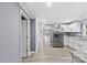 Modern kitchen with stainless steel appliances and white cabinets at 612 Harry St, China Grove, NC 28023