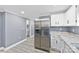 Kitchen with stainless steel refrigerator and granite counters at 612 Harry St, China Grove, NC 28023