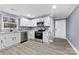 Modern kitchen with white cabinets and granite counters at 612 Harry St, China Grove, NC 28023