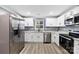 Modern kitchen featuring stainless steel appliances and granite countertops at 612 Harry St, China Grove, NC 28023
