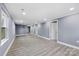 Spacious living area with wood-look flooring and chandelier at 612 Harry St, China Grove, NC 28023