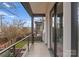 Private balcony with metal railing overlooking a fenced backyard at 621 Mattie Rose Ln, Charlotte, NC 28204