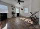 Bedroom with wood floors, ceiling fan, and mounted decor at 813 S Zion St, Landis, NC 28088