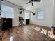 Bright bedroom with wood floors, and two windows at 813 S Zion St, Landis, NC 28088