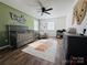 Bedroom with crib, dresser, and accent wall at 813 S Zion St, Landis, NC 28088