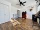 Bedroom with wood floors, double doors, and ceiling fan at 813 S Zion St, Landis, NC 28088
