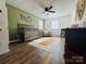 Bedroom featuring crib, armchair, and decorative wall hanging at 813 S Zion St, Landis, NC 28088