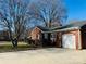 Brick ranch home with attached garage at 813 S Zion St, Landis, NC 28088