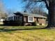 Brick ranch house with mature trees and a spacious yard at 813 S Zion St, Landis, NC 28088