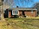 Brick ranch home with deck and front yard at 813 S Zion St, Landis, NC 28088