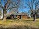 Front view of a ranch house with a large yard and mature trees at 813 S Zion St, Landis, NC 28088
