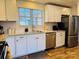 Modern kitchen with white cabinets and granite countertops at 813 S Zion St, Landis, NC 28088